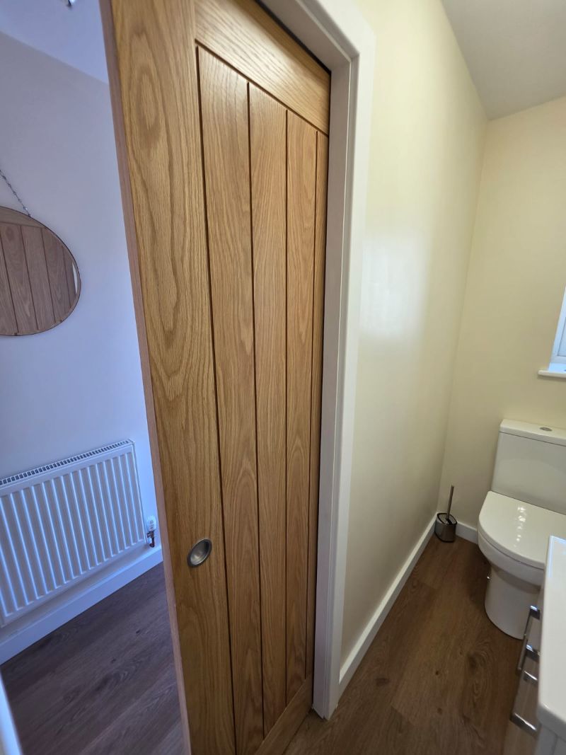 Bedroom door detail in garage conversion in Anglesey and Gwynedd