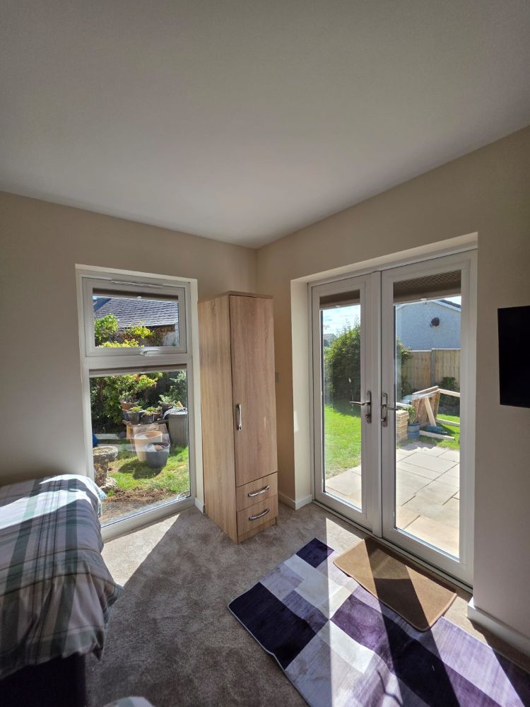 Bedroom patio doors in garage conversion in Anglesey and Gwynedd