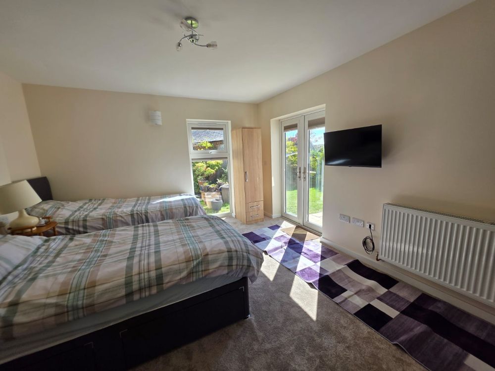 Bedroom TV wall in garage conversion in Anglesey and Gwynedd