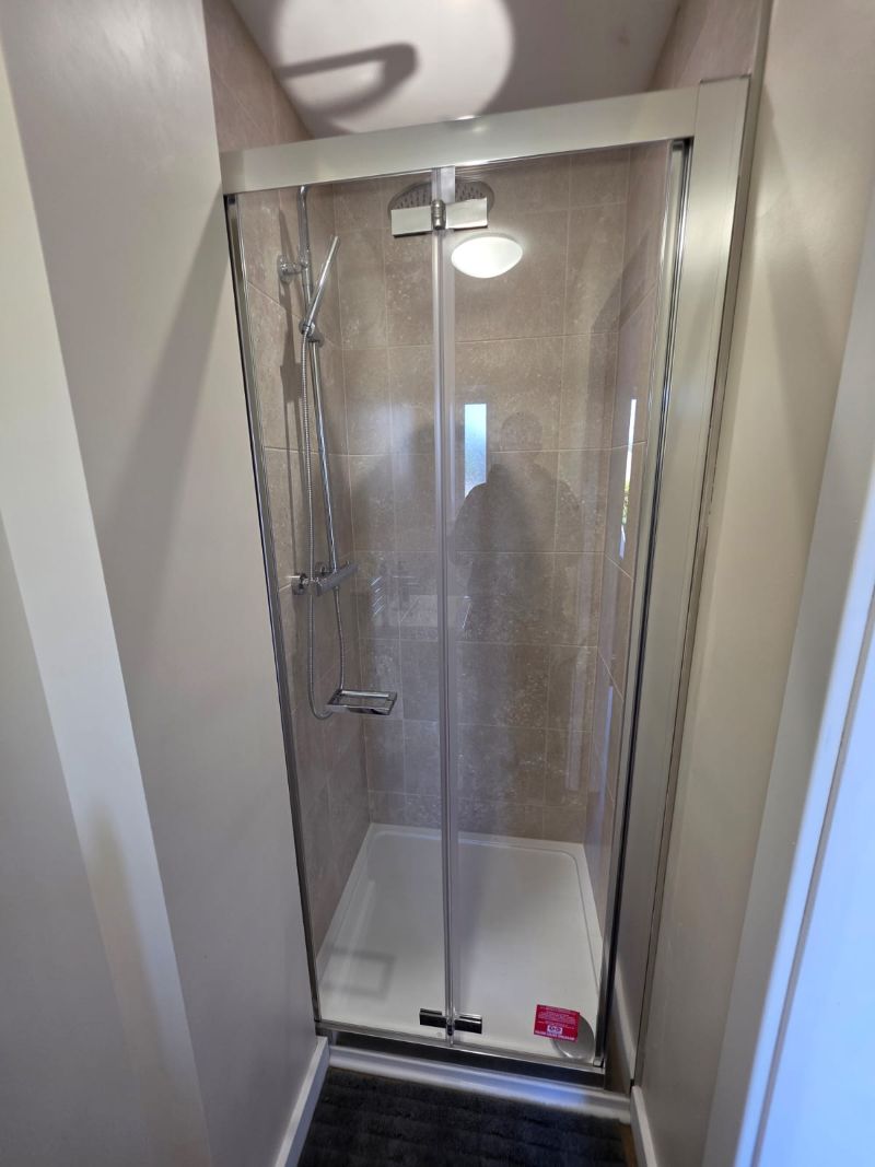 Shower room created during garage conversion in Anglesey and Gwynedd